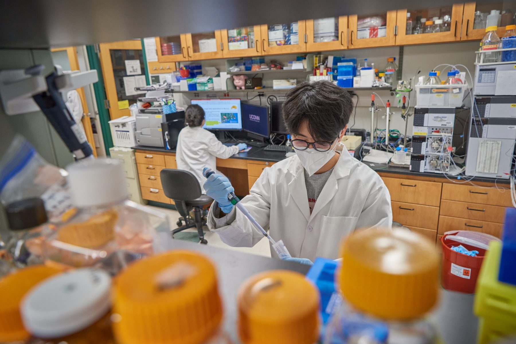 Hyungryun Jang, a Ph.D. student, uses a micropipette at the NutriPrevention of Obesity, Inflammation & Liver Disease (NP-OILD) Lab on May 4, 2021. (Peter Morenus/UConn Photo)